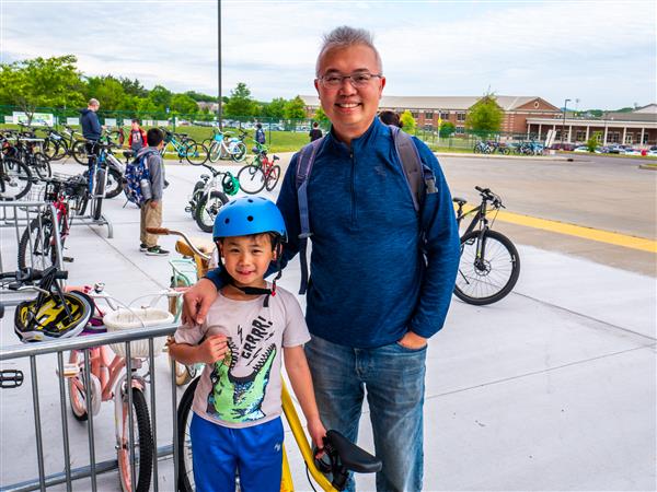 Students bike to school in the morning.